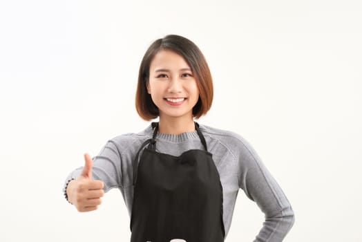 Pretty girl employee rising thumb up and smiling as great services concept with copyspace
