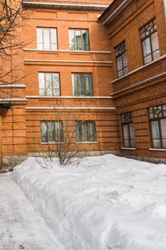 Building and houses in winter season. Snow in city and town architecture