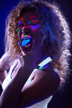 Amusing visage model posing in UV light