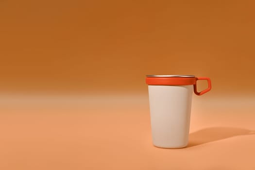 A travel cup with handle on orange background. Tumbler beverage container and Eco friendly lifestyle