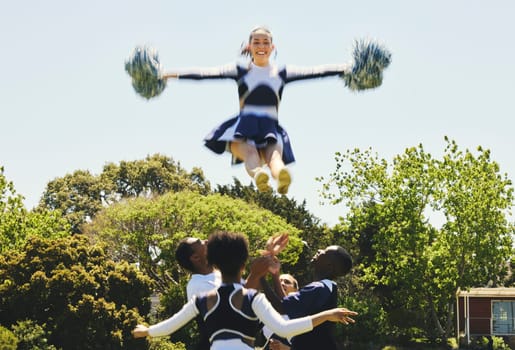 Cheerleader, jump stunt and sports performance on field with teamwork, trust and collaboration. Team, training and prepare for support competition with gymnastics, energy and skill with excellence