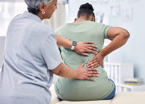 Back pain, physical therapy and chiropractor with patient, spine injury and healthcare with help and people at clinic. Physiotherapy, massage and anatomy with body, support and trust in health