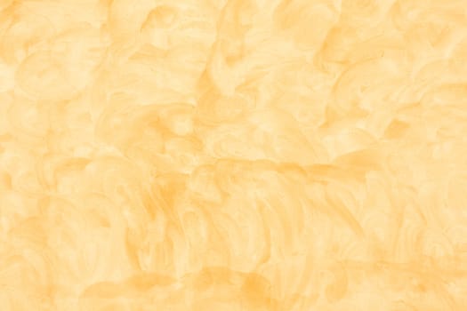 The texture of a yellow cement as a background