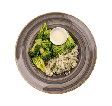 Vegetarian menu concept, broccoli and rice served with sauce