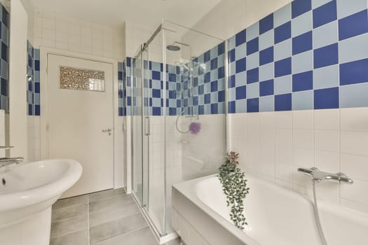 a bathroom with blue and white checkered tiles