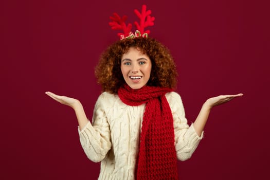 Glad teen woman with deer antlers festive spirit of Christmas and New Year, enjoy winter holidays