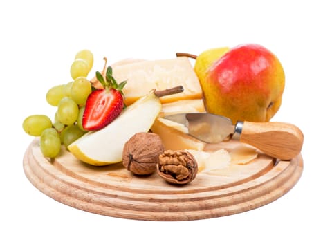 cheese and fruit. parmesan cheese, nuts and ripe pears on a wooden board on a white background