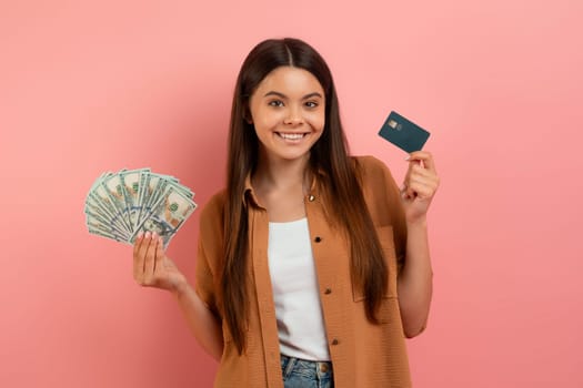Teenage girl holding credit card and cash, contemplating financial choices