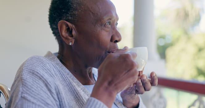 Senior woman, thinking and relax with coffee on a front porch with nostalgia at a nursing home. Assisted living, tea and elderly African female enjoy a calm drink, peace or fresh air alone outdoors