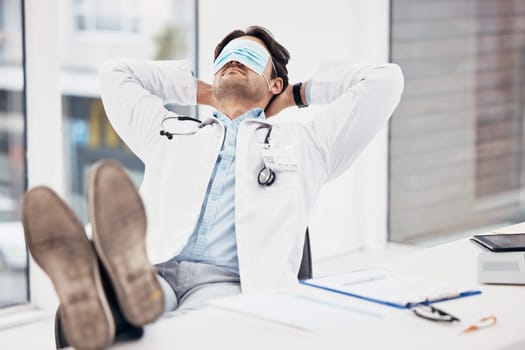 Man, doctor and sleeping with face mask on break or relax for done, completion or finished at hospital office. Tired male person or medical surgeon chilling for rest or asleep on work desk at clinic