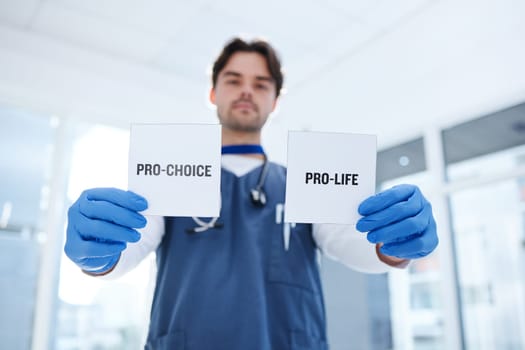 Life, choice and doctor with paper in hands for abortion, human rights or decision in clinic. Nurse, poster and support for women with option of family planning in hospital or medical contraception
