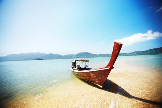Boat, transport and travel, beach and ocean with landscape and paradise, tropical island background with nature and vacation. Holiday in Thailand with transportation, sea vessel and outdoor adventure