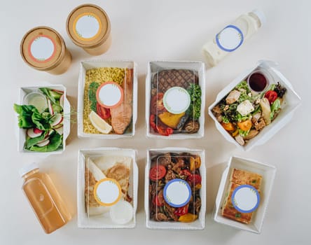 food in containers. proper nutrition, daily diet, weight loss. soup, drink, salad, steak. Top view