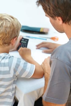 Learning, math and father help child with homework or homeschool as education and development in a home. Calculator, parent and dad support or teaching kid to count, numbers and studying for exam