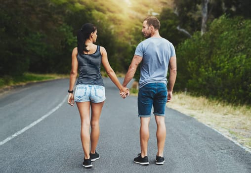 Street, love or happy couple holding hands or walking on date with trust, care for romance or adventure. Loyalty, road or man with woman on holiday vacation together for bond, support or wellness