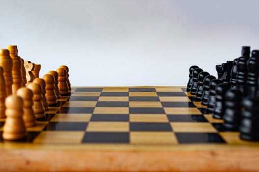 Battle between white and black chess on a chess boar. Strategy and tactics concept.