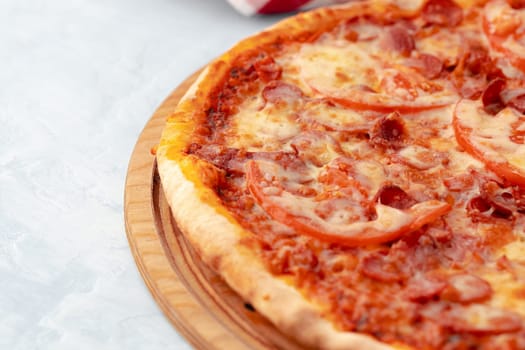 Freshly baked pizza on table close up