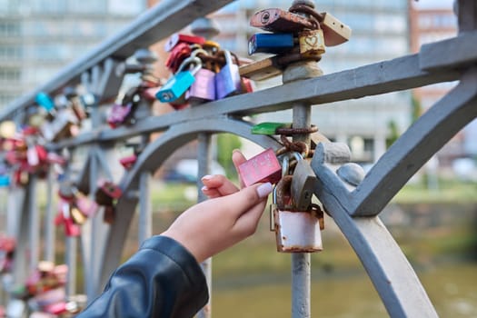 Hamburg, Germany, 1.08.2023, many closed heart love locks on bridge