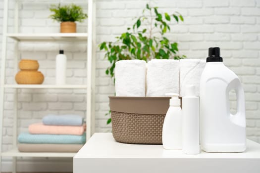 Liquid detergents containers on shelf in a bathroom
