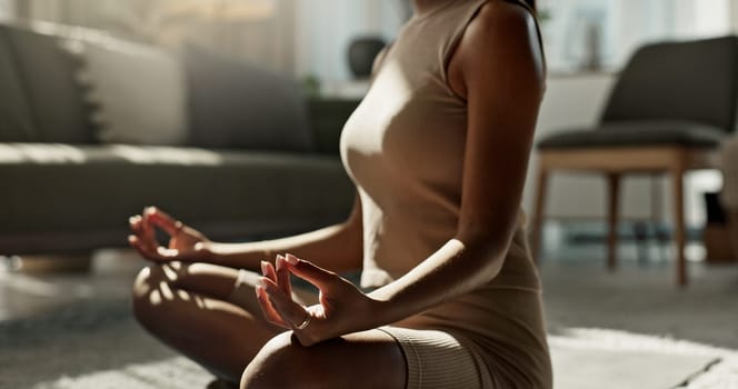 Woman, yoga and lotus on floor, hands and peace for chakra balance, relax and breathing in living room. Girl, meditation and spiritual with pilates workout, wellness and fitness for zen mindfulness