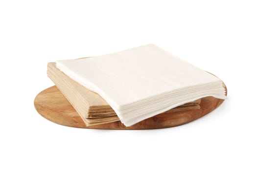 White and beige folded paper napkins close up