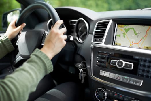 Hands, car interior and digital map on dashboard screen, travel and road trip with person driving and transportation. Navigation, automobile and technology with network, journey and adventure.
