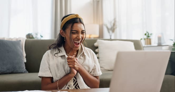 Woman, excited and winning with laptop in home living room on floor with smile, success and profit on stock market. Trader girl, investor or entrepreneur with computer for goals, bonus and revenue