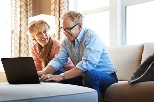 Laptop, mature or happy couple planning savings, property investment or online shopping together. Ecommerce website, smile or senior people typing to search for investing news on pc on sofa at home