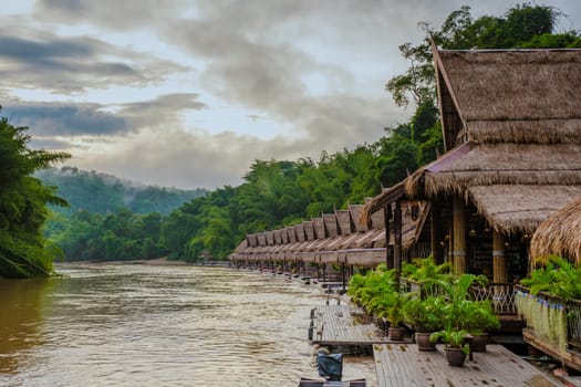 Tropical beach houses on the River Kwai in Thailand