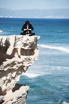 Business man, relax and meditation on cliff, peace and spiritual wellness by ocean, beach and outdoors. Male person, breathing exercise and yoga for stress management, zen mindfulness in Hawaii