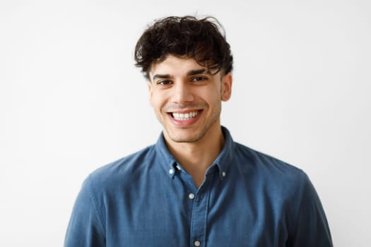 Portrait Of Cheerful Arabian Guy In Casual Over White Background