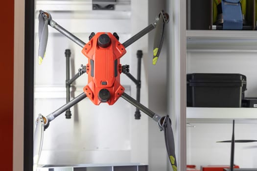 Drone hanging above a workstation.