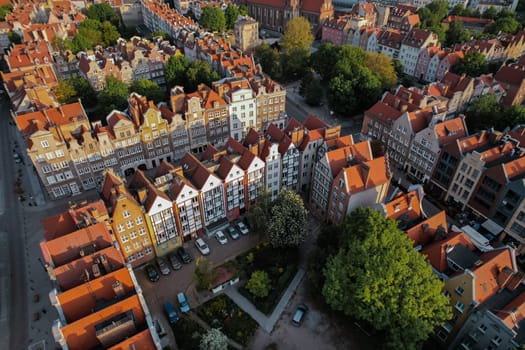 Beautiful panoramic architecture of old town in Gdansk, Poland at sunrise. Aerial view drone pov. Landscape cityscape City from Above. Small vintage historical buildings Europe Tourist Attractions travel destination
