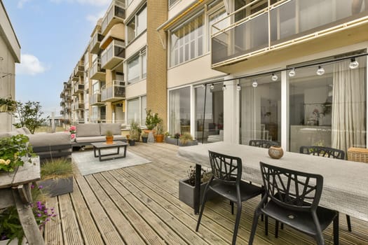 a patio with a table and chairs in an apartment