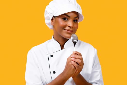 Smiling Young Black Chef Woman Using Spoon As Microphone