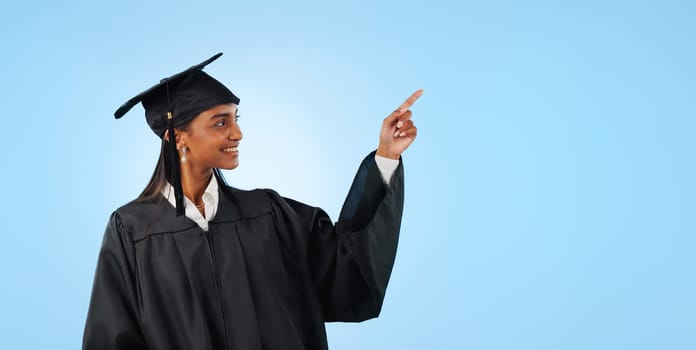 Graduate student, studio and happy woman point at school direction, university commercial or college knowledge development. Mockup space, graduation and higher education choice on blue background