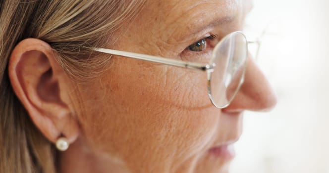 Glasses, closeup and senior woman with idea, thinking and problem solving with memory, nostalgia and clear vision. Elderly person, pensioner or old lady with eyewear, home and alzheimer with eye care
