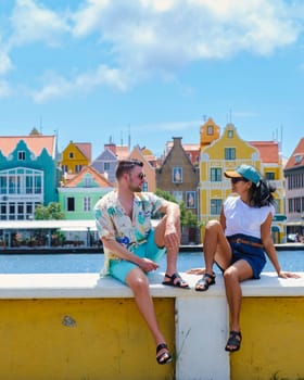 A couple of men and woman visit Willemstad Curacao
