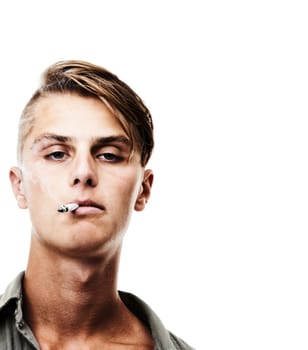 Portrait, face and man smoking cigarette isolated against a white studio background. Cool, attractive or handsome male person, model or smoker chilling or having a casual smoke on mockup space