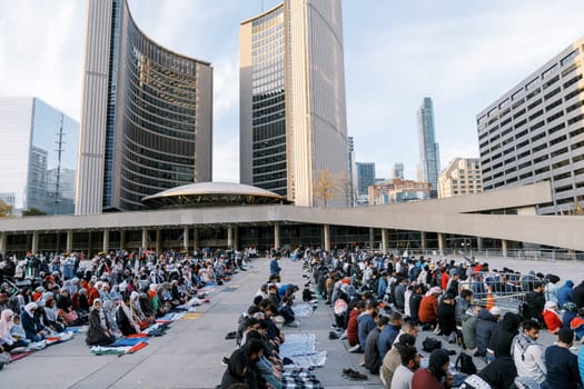 Toronto, Canada - 28 October 2023: Muslim prayer from Palestine in the city square of Toronto. They pray for an end to the war with Israel