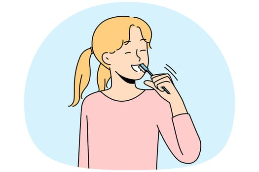 Smiling girl brushing teeth