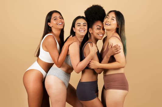 Four joyful women in underwear, celebrating diversity and beauty