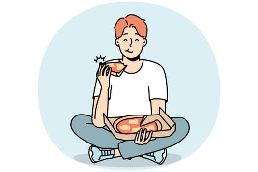 Smiling man eating pizza