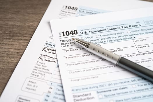 Tax Return form 1040 with pen, U.S. Individual Income.