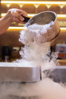 Smoke vapor dry ice in bowl in kitchen