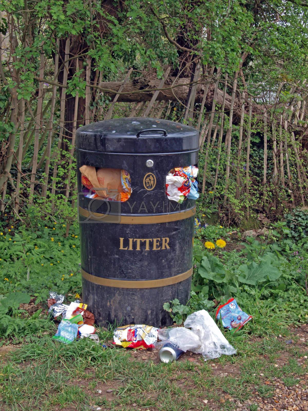 Royalty free image of Overflowing litter bin by ianlangley