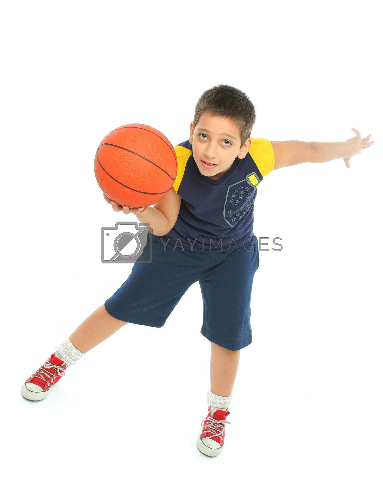 Royalty free image of Boy playing basketball isolated by Erdosain