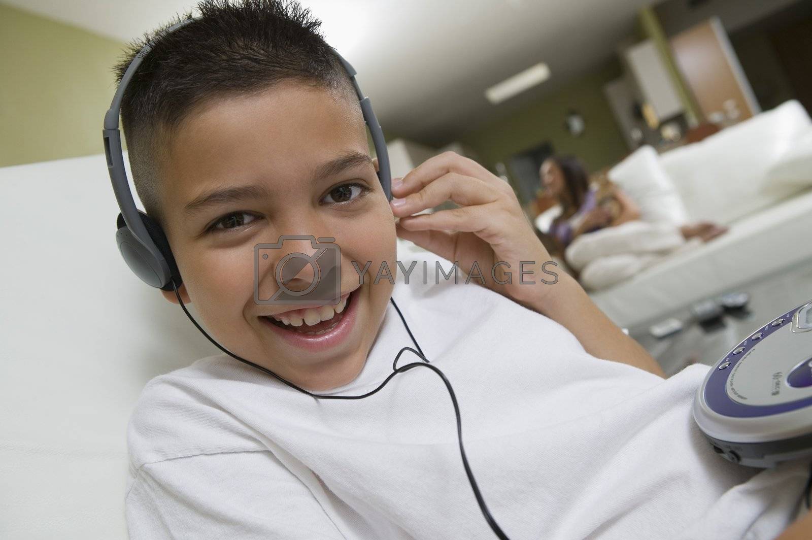 Royalty free image of Boy Listening to Music on Portable CD Player by moodboard