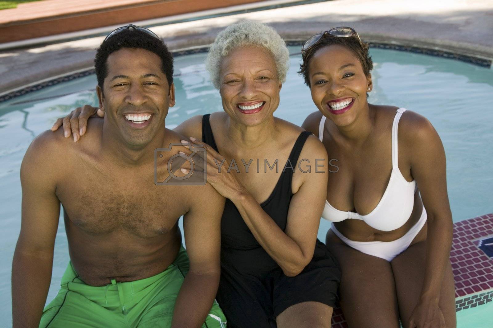 Royalty free image of "Mother, Son and Daughter-in-law Poolside" by moodboard