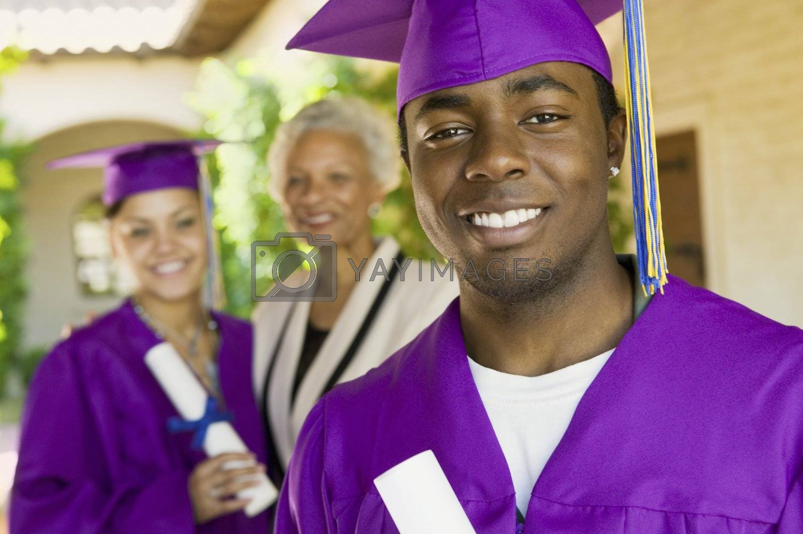 Royalty free image of Graduates and Grandmother by moodboard